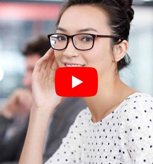 Female At Desk Smiling While Scheduling Invoice Reminders using Zetadocs