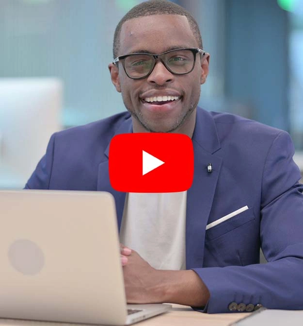 Man at desk, happy after using Zetadocs Capture on Business Central to automate his AP processes