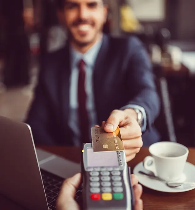 Man paying for a business expense using company credit card
